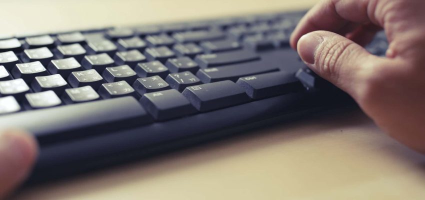 Fingers typing on keyboard